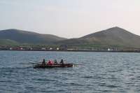Ladies curragh rowing team training in Smerwick Harbour